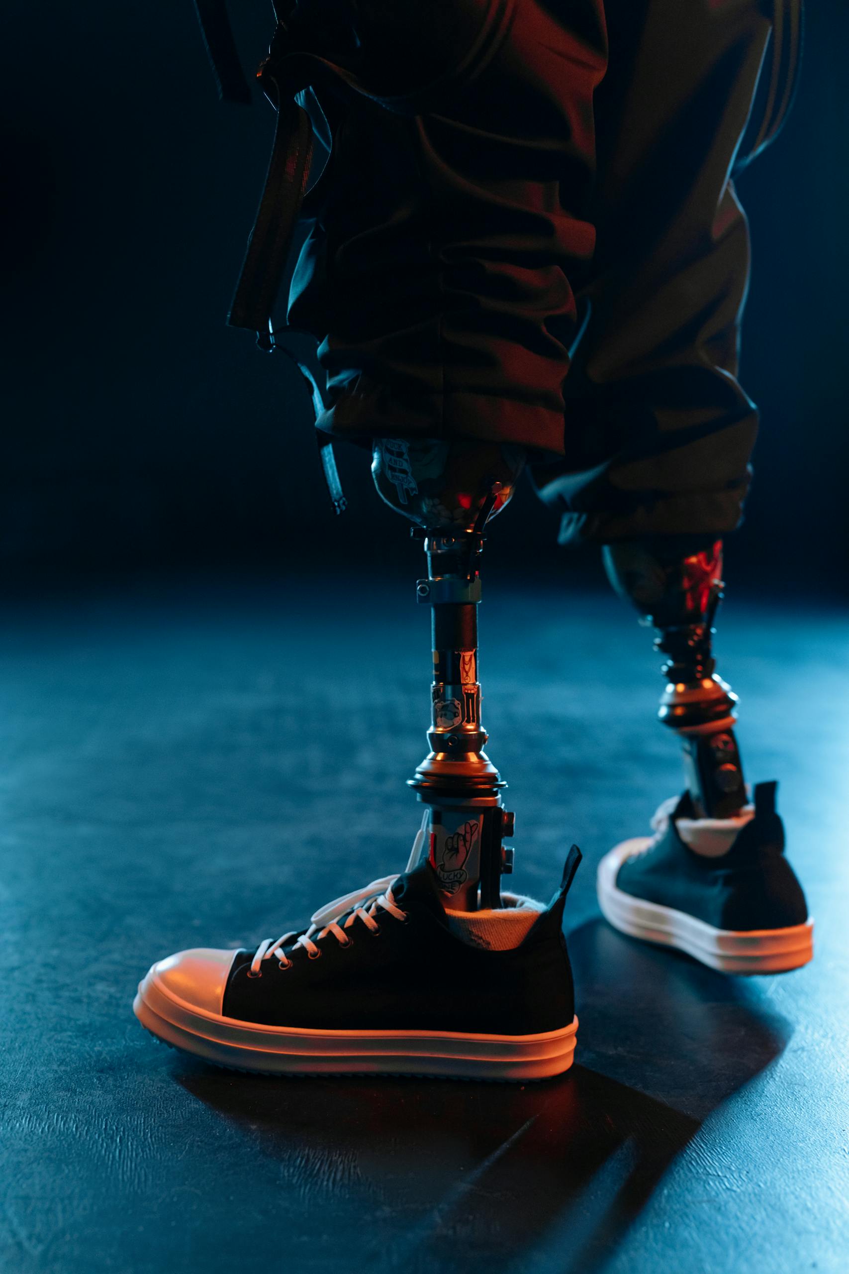 About HCPL Global - Our Story 12 Close-up of prosthetic legs in sneakers, showcasing modern technology and lifestyle.